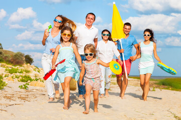 group of people jumping on the beach