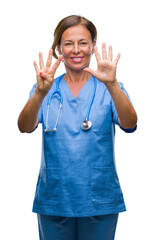 Middle age senior nurse doctor woman over isolated background showing and pointing up with fingers number nine while smiling confident and happy.