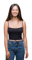 Obraz premium Young asian woman wearing glasses over isolated background with a happy and cool smile on face. Lucky person.