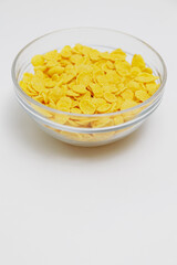 Glass bowl with corn flakes with copy space