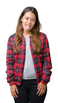 Young beautiful brunette woman wearing a jacket over isolated background sticking tongue out happy with funny expression. Emotion concept.