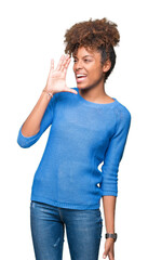 Beautiful young african american woman over isolated background shouting and screaming loud to side with hand on mouth. Communication concept.