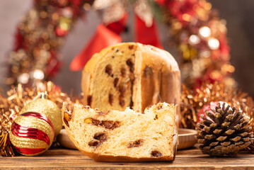 Panettone, panettone with chocolate flavors on a rustic table with Christmas decorations. Selective...