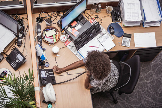 Colleagues with diverse backgrounds working, talking and hanging out in large office space. Cape Town, South Africa