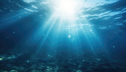 Fototapeta na wymiar Blue ocean underwater with sunrays reaching background
