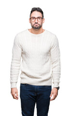 Fototapeta premium Young handsome man wearing glasses over isolated background depressed and worry for distress, crying angry and afraid. Sad expression.