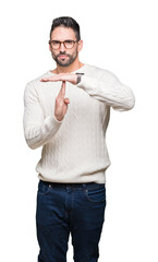 Young handsome man wearing glasses over isolated background Doing time out gesture with hands,...