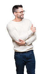 Fototapeta premium Young handsome man wearing glasses over isolated background Looking proud, smiling doing thumbs up gesture to the side