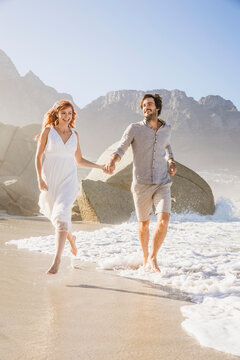 Couple getting married on the beach, boho style wedding, with loads of romance. Cape Town, South Africa
