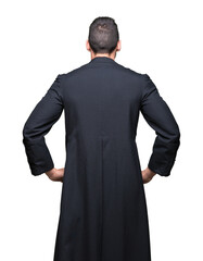 Young Christian priest over isolated background standing backwards looking away with arms on body