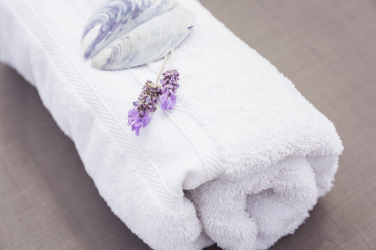 Towel and flowers on a chaise lounge at the pool