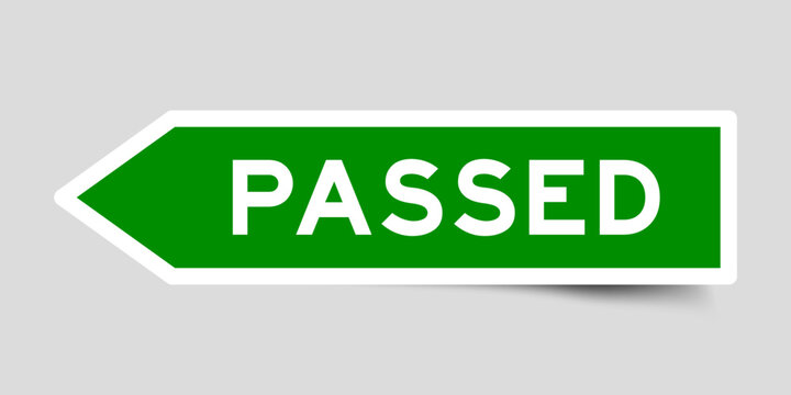 Green color arrow shape sticker label with word passed on gray background