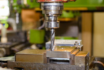 The drilling process on NC milling machine with brass material.