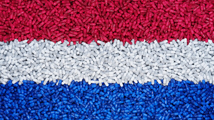 Flag of Netherlands made from capsule pills. The Pharmaceutical Industry in the Netherlands