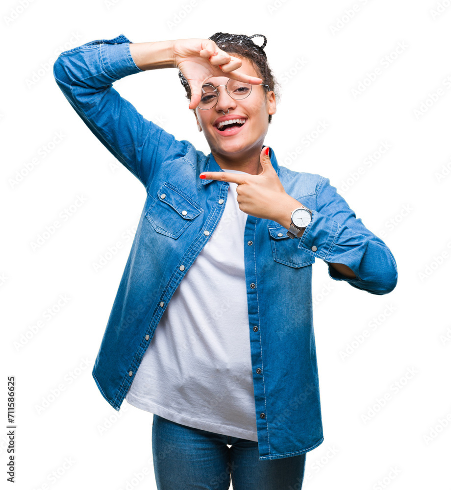 Poster Young braided hair african american girl wearing glasses over isolated background smiling making frame with hands and fingers with happy face. Creativity and photography concept.