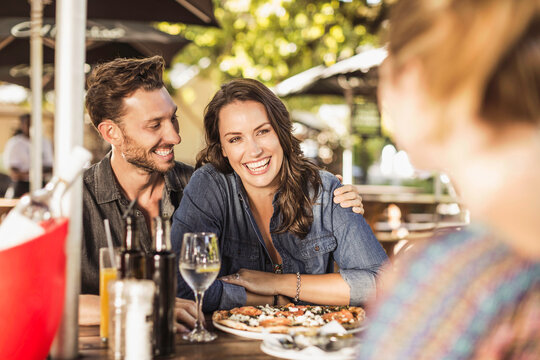 Romantic couple having a happy time at an outdoor restaurant.