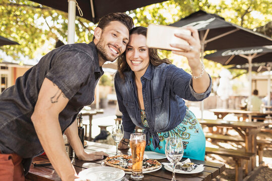 Romantic couple having a happy time at an outdoor restaurant.