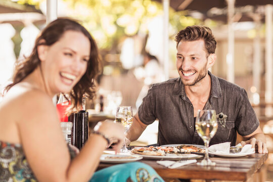 Romantic couple having a happy time at an outdoor restaurant.