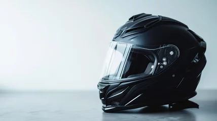 Poster Sleek black motorcycle helmet on a minimalist white background © Artyom