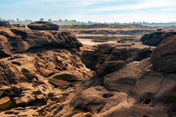 Grand Canyon in Thailand, Nature of rock canyon in Mekong River, Dry rock reef in the Mekong River with mountain hills. View of Sam Phan Bok is called Valley of Thailand. Nature landscape background.