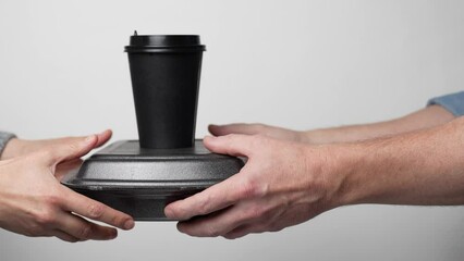 Hand give take away delivery food box container and coffee cup