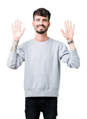 Young handsome man wearing sweatshirt over isolated background showing and pointing up with fingers number ten while smiling confident and happy.