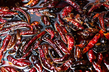Dried peppers and put them into the pot of spicy soup.