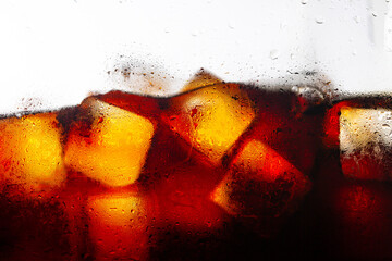cola and ice background,Pouring cola soda with ice and bubbles on white front view, cold drink...