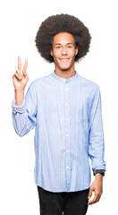 Young african american man with afro hair showing and pointing up with fingers number two while smiling confident and happy.