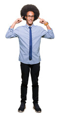 Young african american business man with afro hair wearing glasses Smiling pointing to head with both hands finger, great idea or thought, good memory