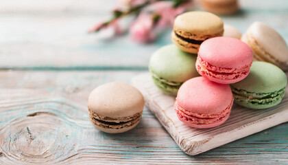 Delicate pastel French macaroons arranged on a dreamy bokeh background, creating a sweet and visually pleasing dessert composition