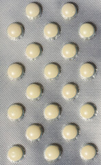 Blister pack with round yellow pills, top view