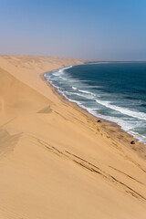 Fototapeta na wymiar dunes slopes on foreshore at Sandwich Harbour, Namibia