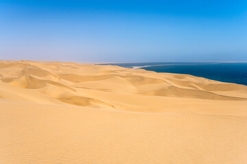 Fototapeta na wymiar waves of dunes at Sandwich Harbour, Namibia