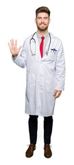 Young handsome doctor man wearing medical coat showing and pointing up with fingers number five while smiling confident and happy.