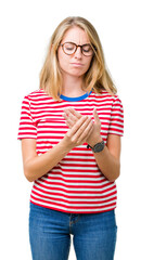 Beautiful young woman wearing glasses over isolated background Suffering pain on hands and fingers,...