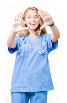 Beautiful young doctor woman wearing medical uniform over isolated background Smiling doing frame using hands palms and fingers, camera perspective