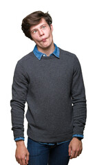 Fototapeta premium Young handsome elegant man over isolated background making fish face with lips, crazy and comical gesture. Funny expression.