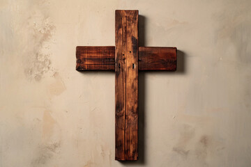 Wooden cross on a textured white wall with shadows