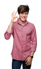 Young handsome business man over isolated background smiling positive doing ok sign with hand and fingers. Successful expression.