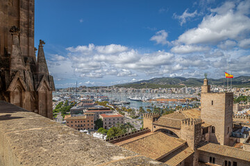 View from the terrace of the medieval Cathedral of Santa Maria of Palma of the roof of the Royal Palace of La Almudaina, Palma de Mallorca, Spain - 711646642