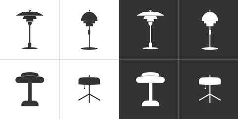 Four flat icons of table lamps. Black and white