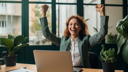 Joyful business woman freelancer entrepreneur smiling and rejoices in victory