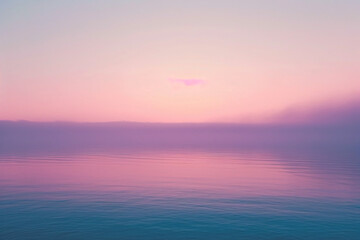 Naklejka na ściany i meble Pastel pink and purple hues over a tranquil sea at sunset