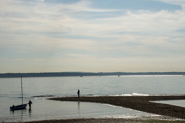 small sailboat in the sea at Lee on Solent Hampshire England with The Isle of Wight in the background