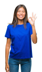 Young asian woman over isolated background smiling positive doing ok sign with hand and fingers. Successful expression.