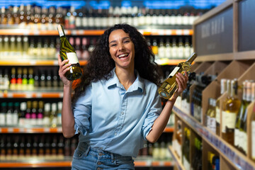 Happy young woman selecting a wine bottle in a liquor store, with a radiant smile surrounded by...