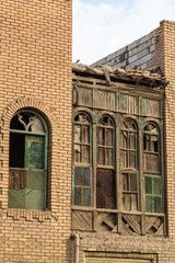 Basra, Iraq - 12 November 2022: Old wooden carved balcony and window in old town of Basra