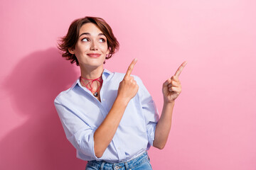 Portrait of positive girl with bob hair wear blue stylish blouse directing look at empty space...