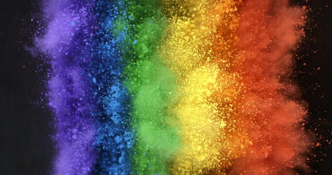 Super slow motion close up of rainbow flag of peace explosion of colorfoul powder with flying particles isolated on black background at 1000 fps.